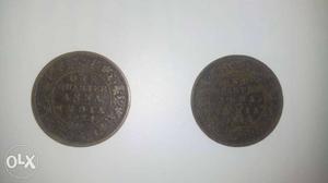 Two Round Black And Gray Coins