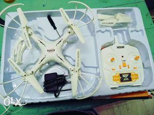 White Quadcopter Drone With Remote And Box