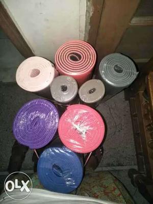 Yoga mats of different colors and thickness
