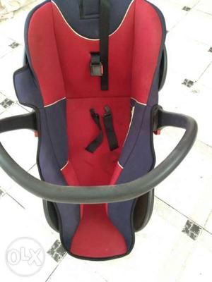 Almost new baby car seat and carry cot with belts