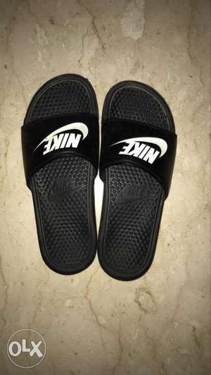 Nike size 8 black sliders with white sign