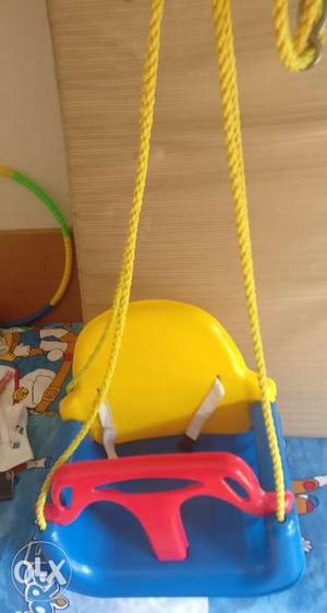 Plastic swing for indoor or outdoor use for childr from