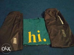 Two Black Bottoms And Green Crew-neck Shirt