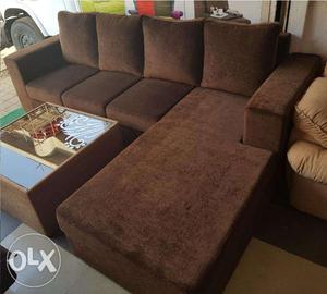 BRAND NEW L shape sofa in brown fabric.