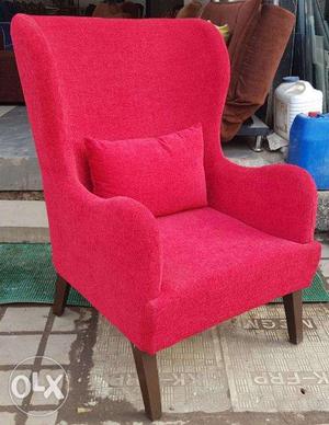 BRAND NEW Wing arm chair in red colour.