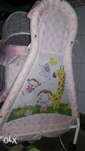 Baby's Pink And Multicolored Cradle