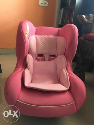 Baby's Pink And White Car Seat