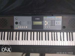 Black And Gray Yamaha Electronic Keyboard E233
