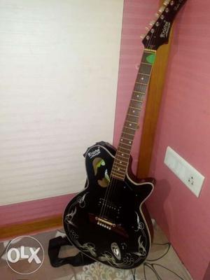 Black acoustic Electric Guitar. Its like non use.