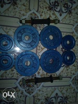 Blue Barbell Plates 7.5 kg 4 plates & 1.25 kg 4 plates.