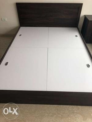 Brand new queen size bed with storage and bedside