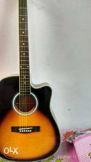 Brown And Black Cutaway Acoustic Guitar