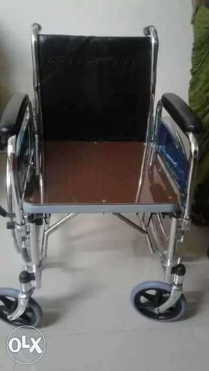 Brown And Black Wheelchair With Silver Frame