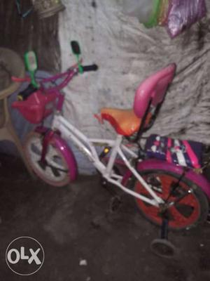 Children's White And Pink Bicycle
