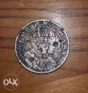 Its a silver coin of king George v Mary from 