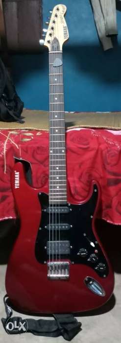 Red And Black Stratocaster Guitar Very good condition 1 year