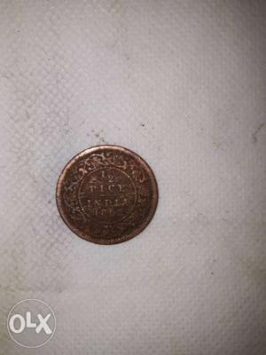 Round Copper-colored Half Indian Pice Coin