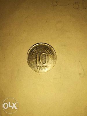 Round Silver-colored Indian 10 Paise Coin