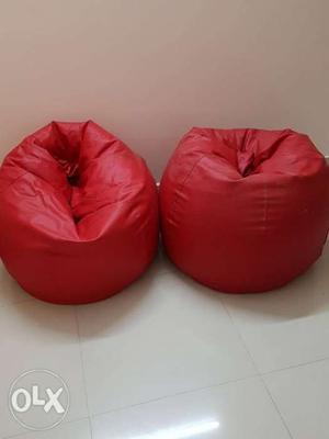 Two Red Leather Bean Bag Chairs