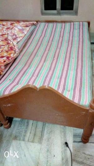 Two single wooden bed not foldable..