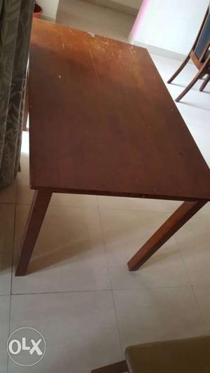 Wooden dinning table with 4 chairs in good condition