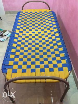 Yellow And Blue Checkered Folding Bed