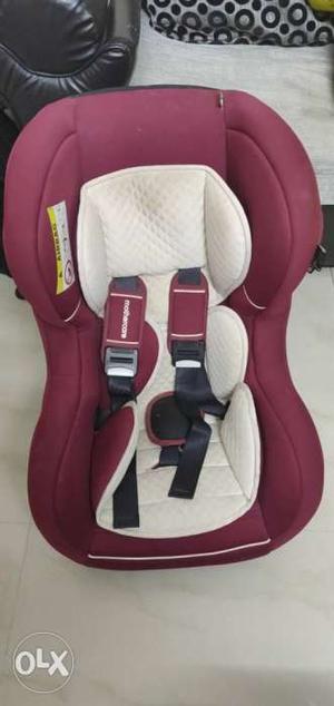 Baby's Red And White Car Seat