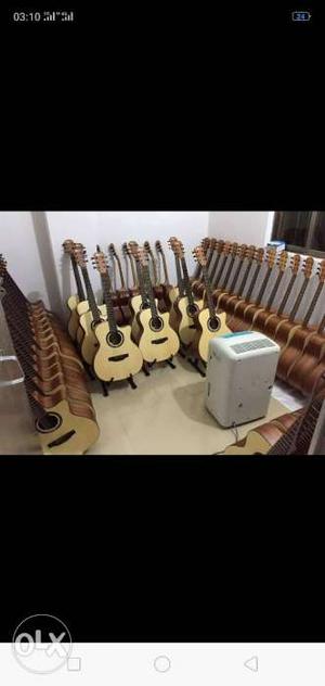 Beige Cutaway Acoustic Guitar Lot Screenshot