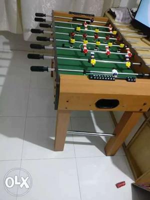 Brown And Green Foosball Table