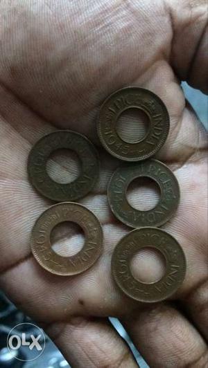 Five Copper-colored Indian Pice Coins