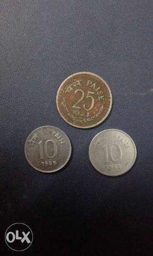 Two Round Silver-colored 10 Indian Paise And One Round