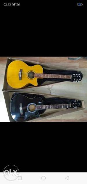 Yellow And Black Acoustic Guitars Screenshot