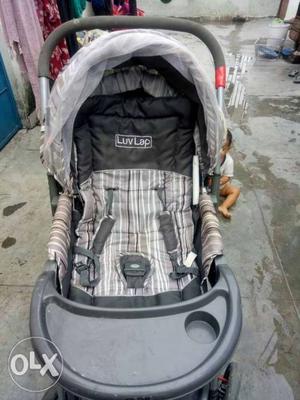 Baby's Gray And Black Graco Stroller