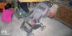 Baby's Gray And Pink Stroller