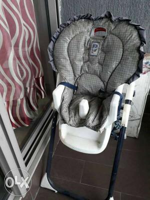 Baby's Gray And White high chair