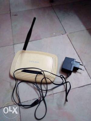 Beige TP-Link Wi-Fi Router