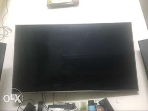 Black Flat Screen TV With Remote
