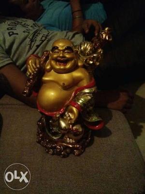 Gold-colored And Red Buddha Figurine