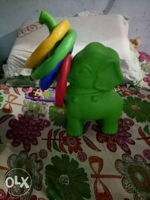 Green And Purple Plastic Toy