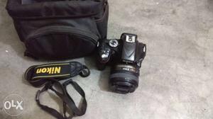 Nikon d with  mm lens, bill and bag