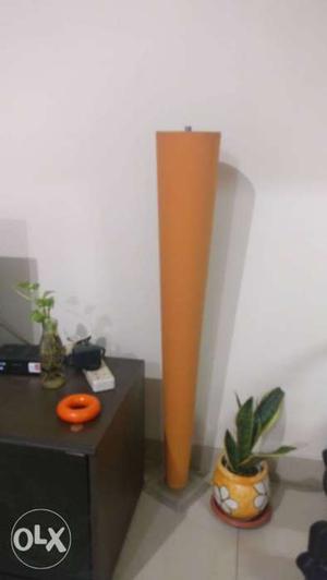 Orange fabric floor lamp with lamp tube in