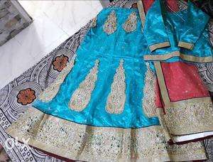 Peach and blue with maroon border lehnga and top...