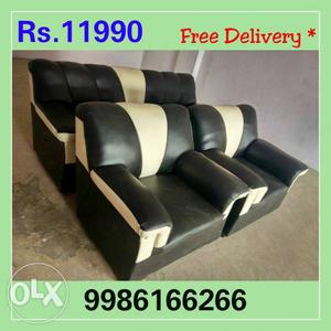Two Black Leather Sofa Chairs