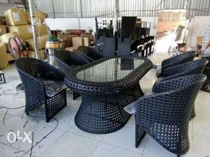 Two Black Wicker Armchairs With Coffee Table