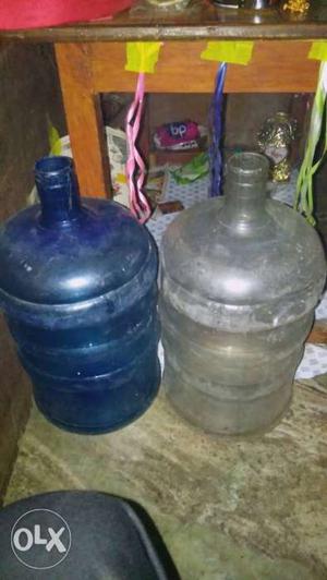 Two Clear And Blue Carboys