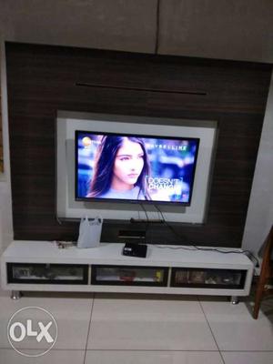 Wooden TV unit with three drawers. Good condition