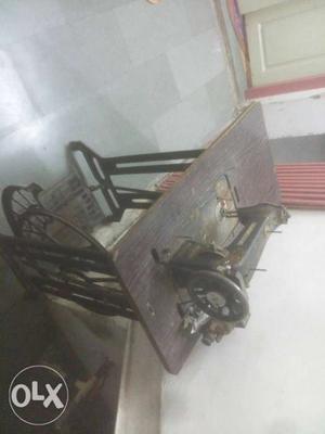 A sewing machine with motor and cover. of