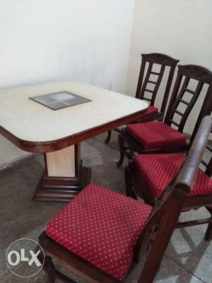 Dining table with 4cushioned chairs