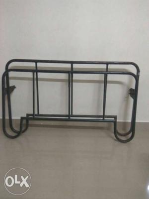 Metal cot specially ordered with heavy top Sheet