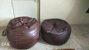 Two Round Brown Leather Beanbag Chairs